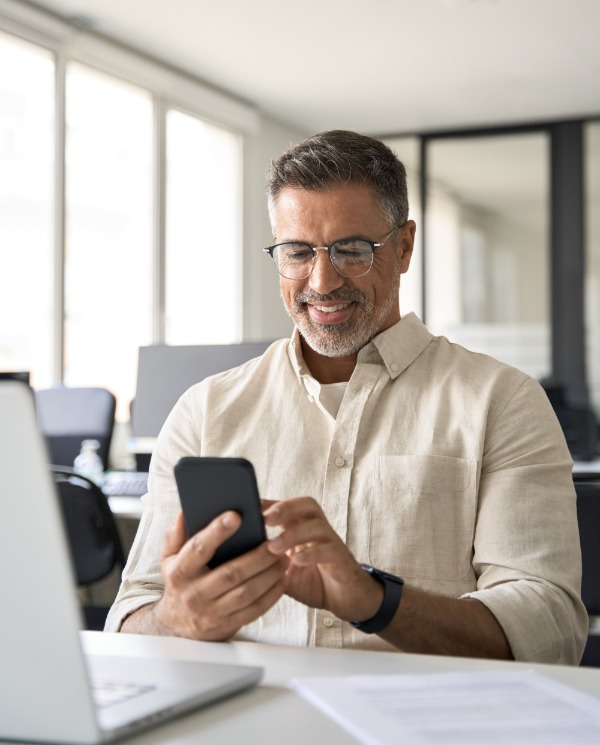 Man on cell phone in office