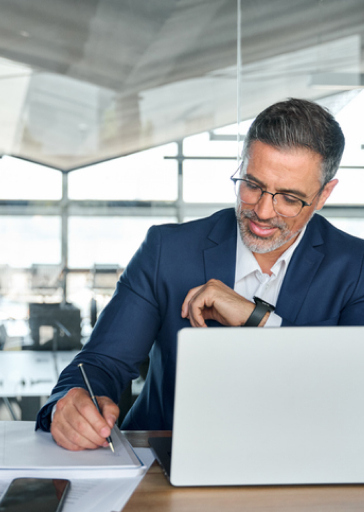 Mature man working at laptop