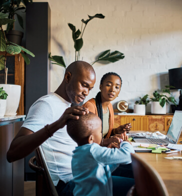 Family of three at a table