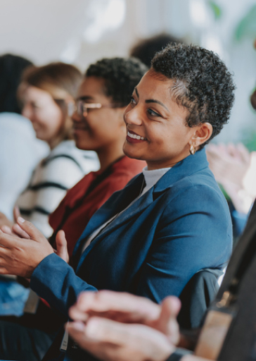 Woman smiling during a lecture