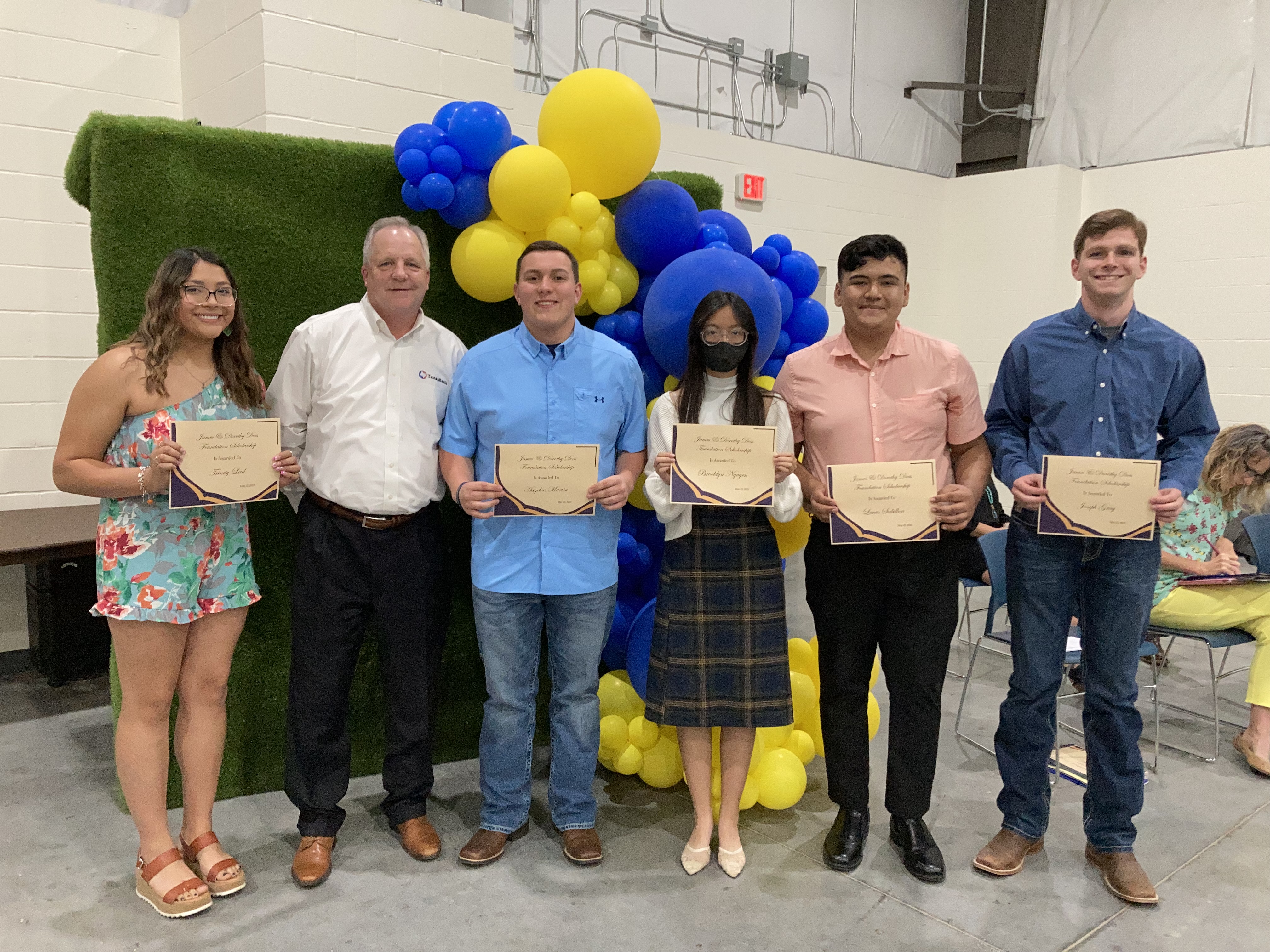 SVP Doyle Cooper with Stephenville High recipients