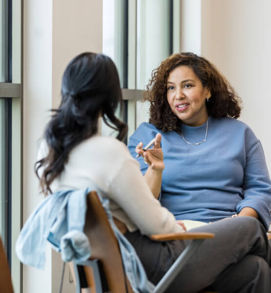 Women in a meeting talking together