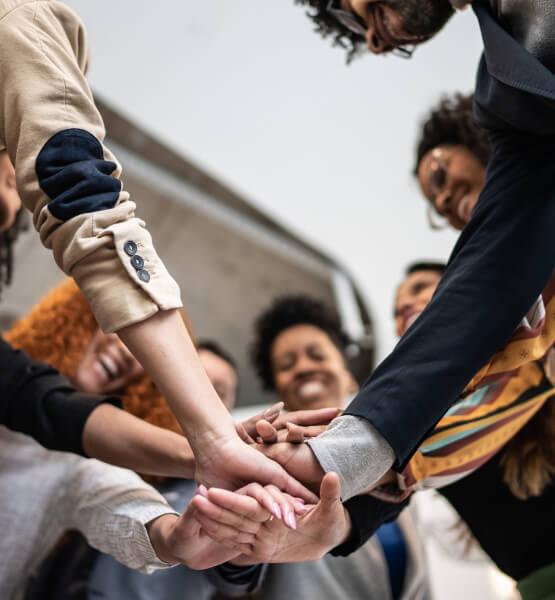 Diverse group of people with their hands together