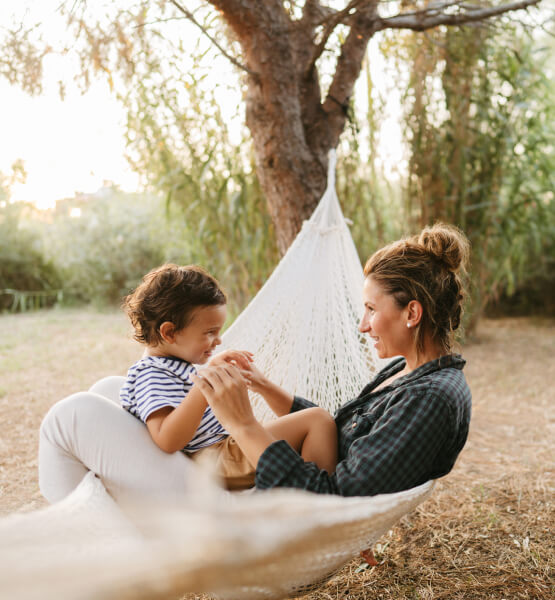 Mother and son within hammock 