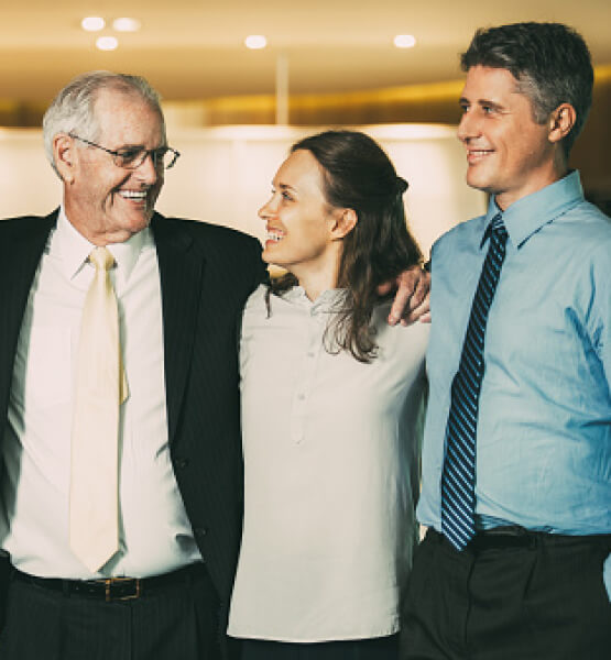 A team of coworkers of diverse ages smiling together