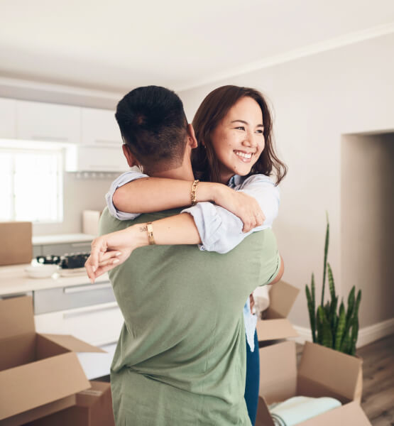 Couple hugging each other in their new kitchen